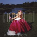 24-06-2001 Patricia Paay at home in Rijkevorsel, Belgium. By order of Beaumonde Magazine. May 24, 2001.

[keywords]Posed, Garden, Smiling, Chair[/keywords]